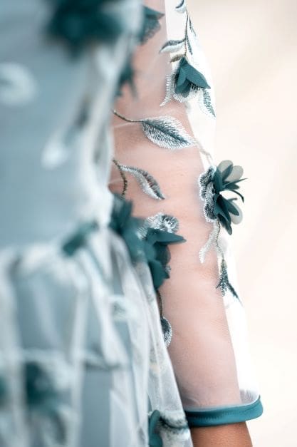 Close up shot of the sleeve of Simplicity pattern 8545 in emerald green