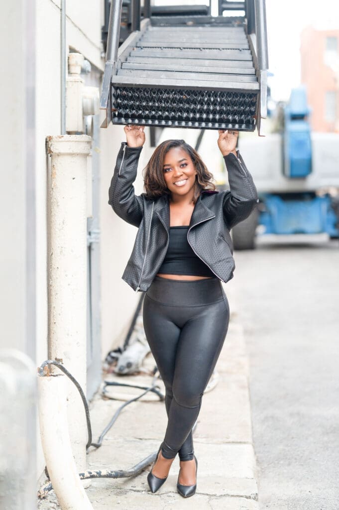 African American Women in an alley in spanx wearing McCalls 8121 moto jacket