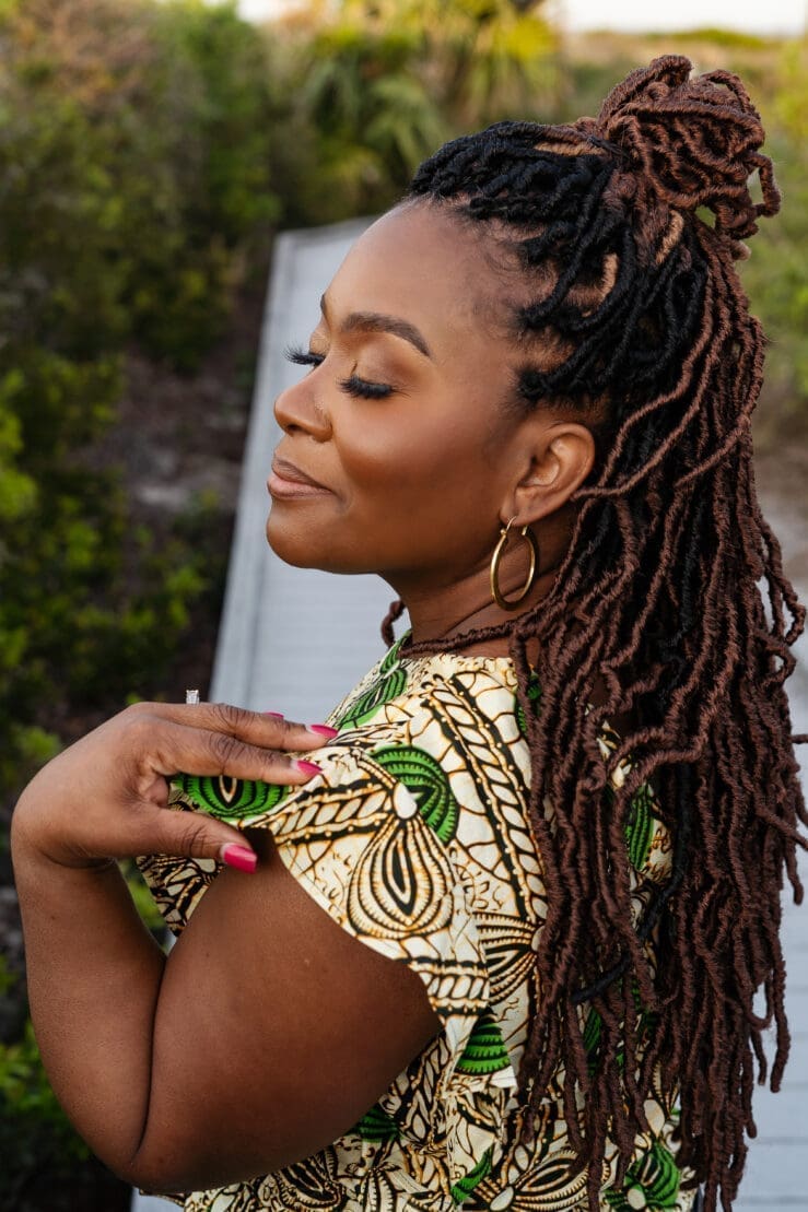 African American women with her eyes closed in Ankara top Simplicity 9605