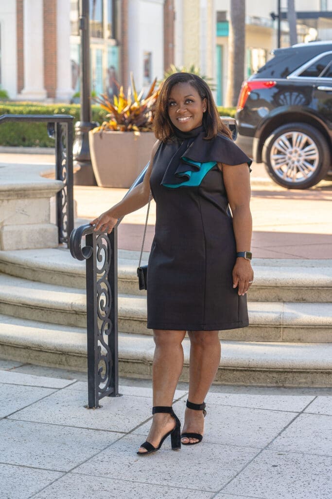 African American woman wearing Vogue 1513 standing near a staircase