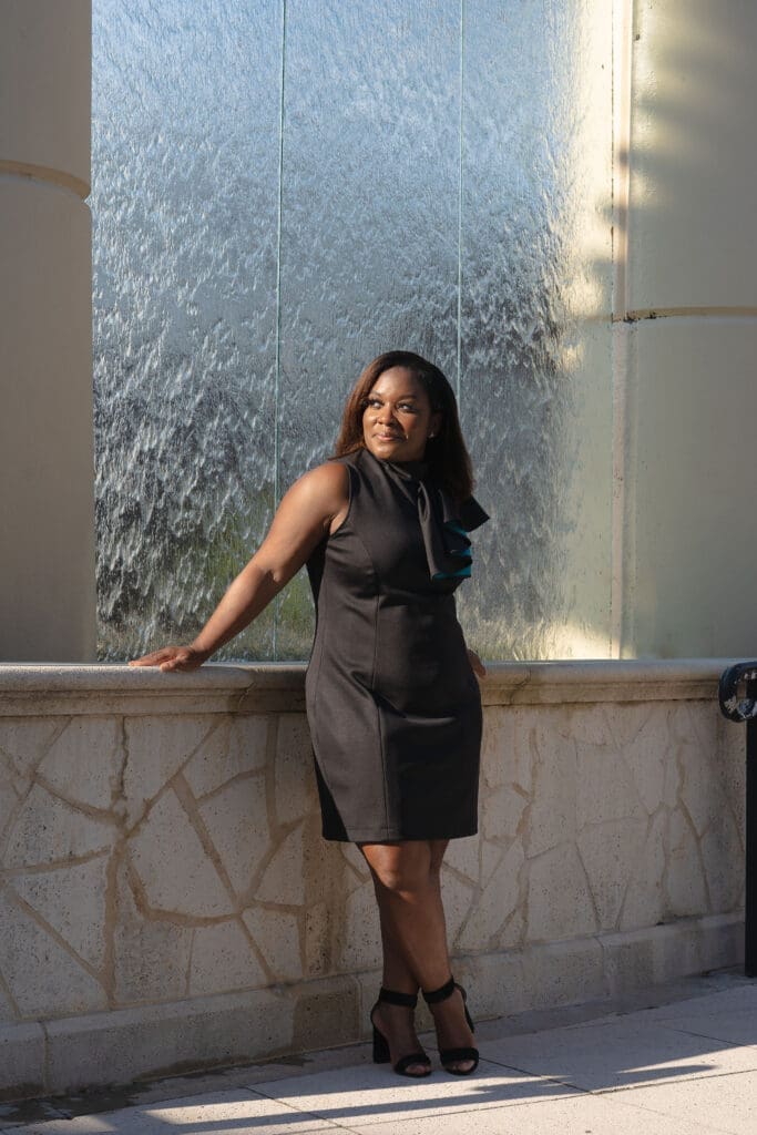 African American woman wearing Vogue 1513 standing in front of a waterfall