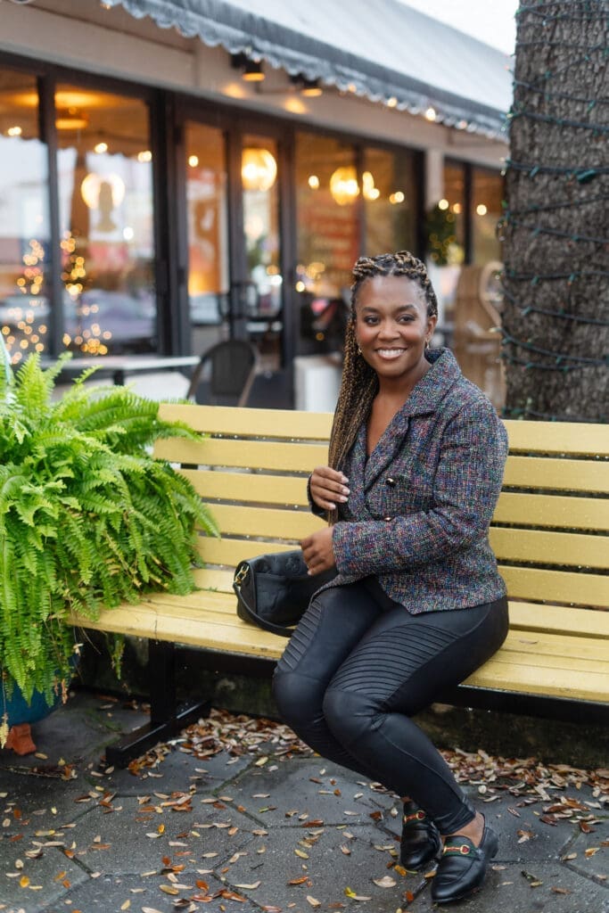 Sewing For My Sanity African American Woman sitting on bench in McCalls 8155 tweed jacket