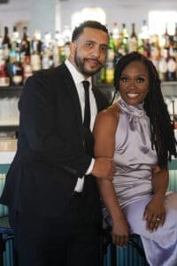 Couple at restaurant woman wearing Mccalls 8141 view C in silver satin