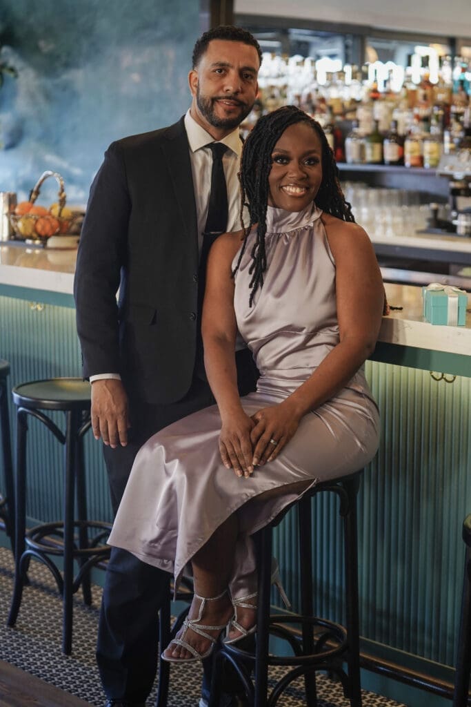 Couple at restaurant woman wearing Mccalls 8141 view C in silver satin