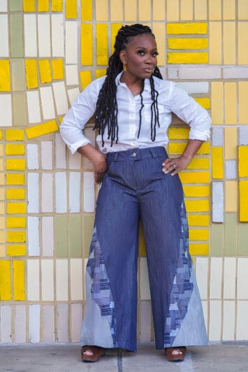 Shontae Buffington of Sewing for My Sanity in McCalls 8408 jeans on a yellow art wall