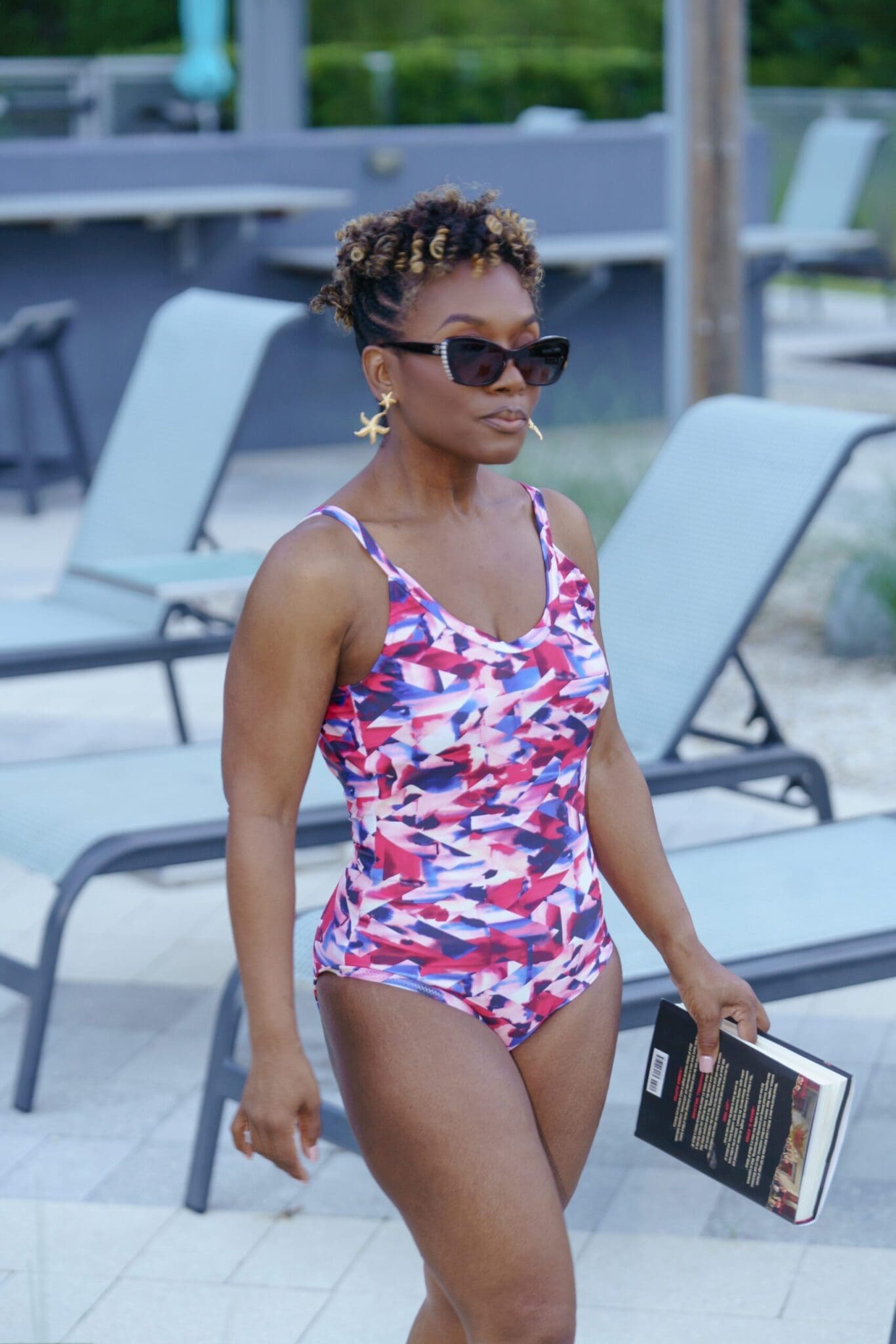 Close up of high quality swimwear fabric construction and perfect fit on a petite frame