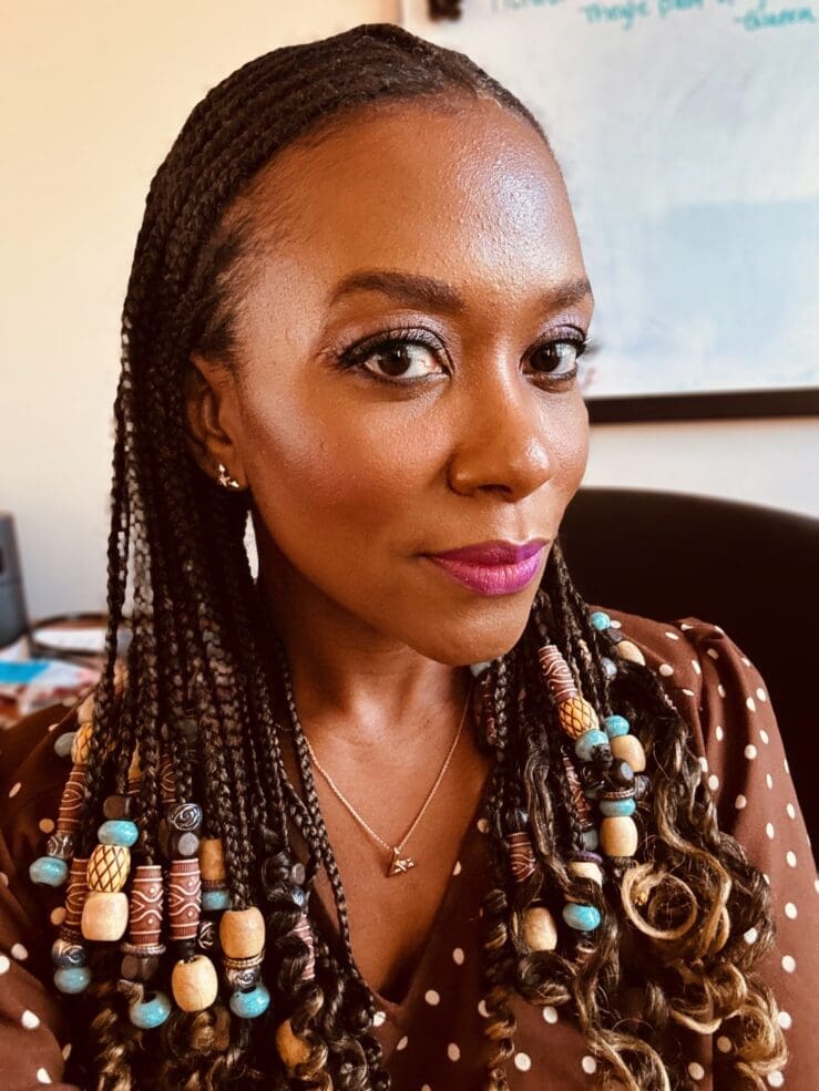 fulani braids sewing for my sanity; Close-up portrait of the blog author, a Black woman with beautiful, beaded Fulani braids, looking confidently at the camera