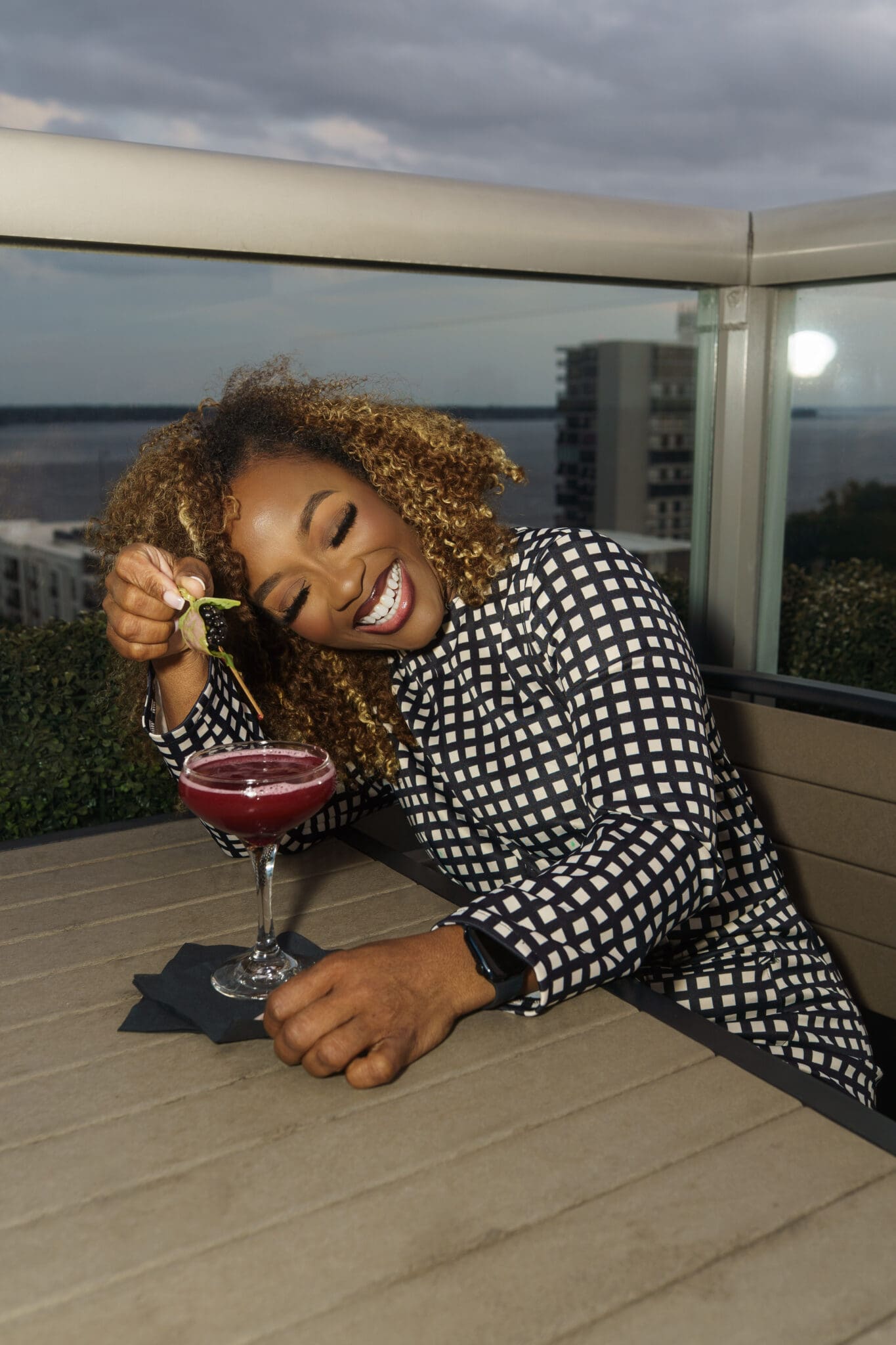 Style strategist wearing a self-constructed McCall’s M7539 romper hack for an evening rooftop look