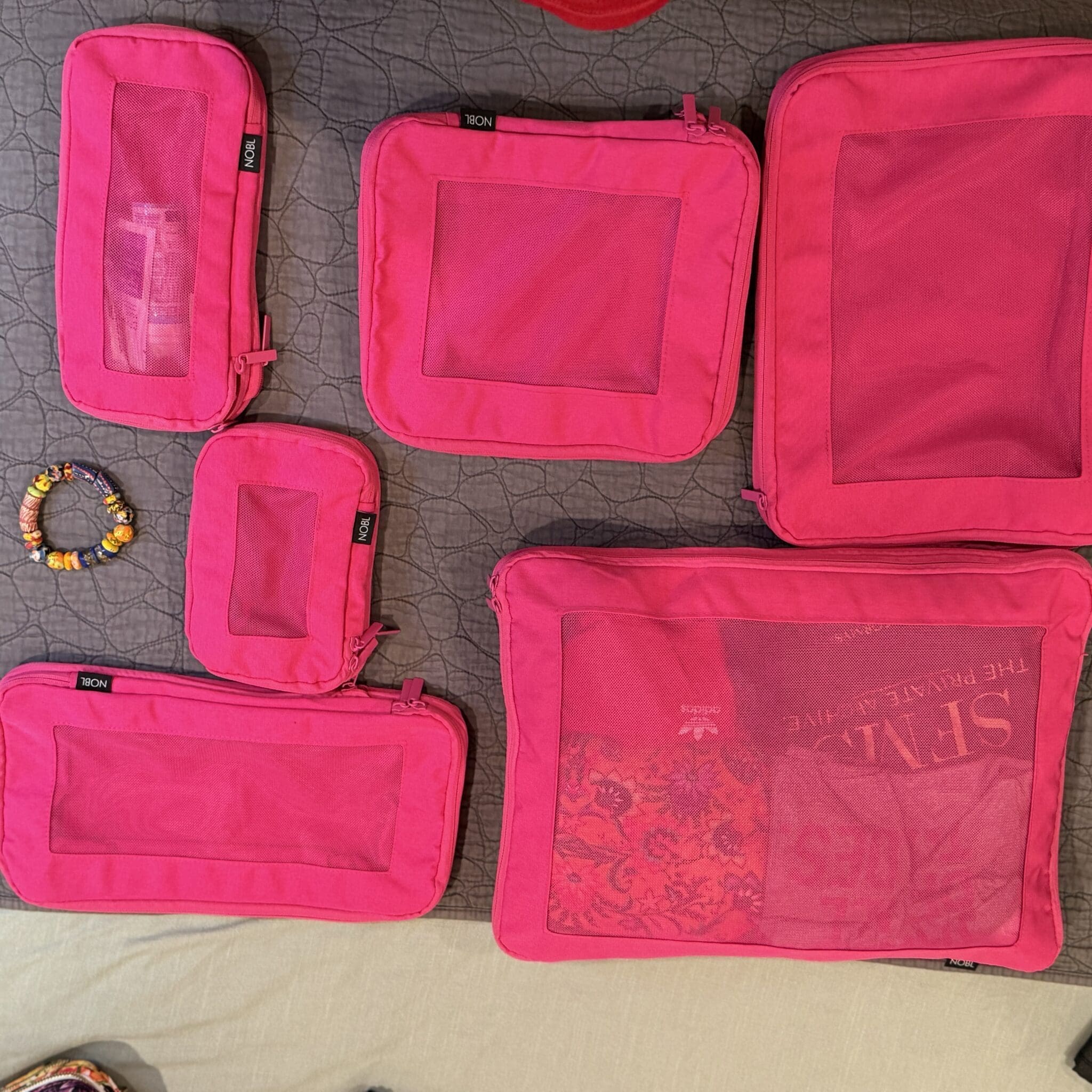 Comparison of Nobl, Away, and Eagle Creek Packing Cubes with Tumi Backpack
