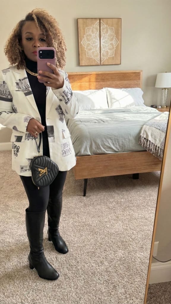 Evening Desigual outfit idea demonstrating how to style a statement blazer with black leggings and tall structured leather boots.