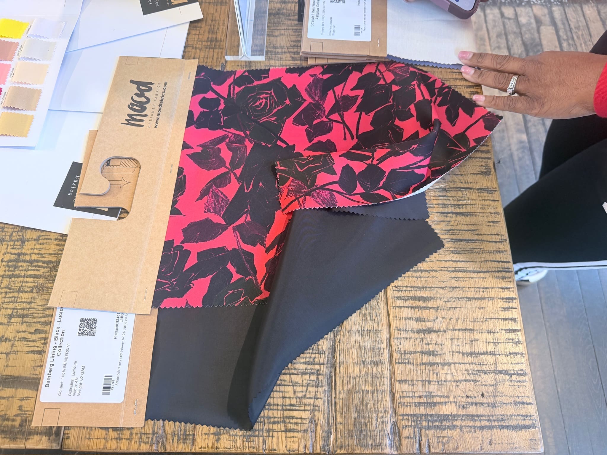 Close-up of premium textile swatches and curated notions available for order at the new Mood Fabrics Atlanta location